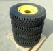 wolf paws pro series skid steer rims & tires - set